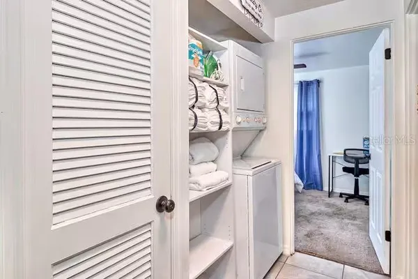 a kitchen with a stove a sink and a refrigerator
