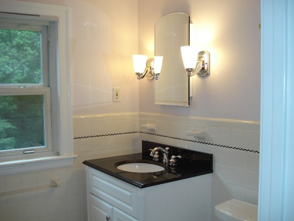 116 Edmunds Road Wellesley, MA 02481 - Photo 12 of 14 a bathroom with a granite countertop sink and a mirror
