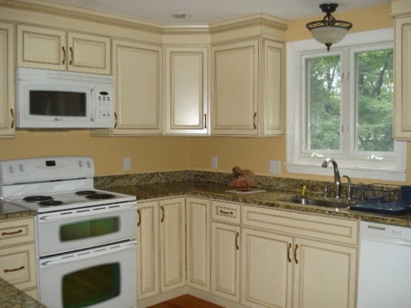 116 Edmunds Road Wellesley, MA 02481 - Photo 2 of 14 a kitchen with granite countertop white cabinets and white appliances