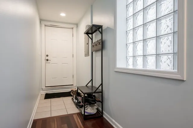 a view of an entryway with wooden floor