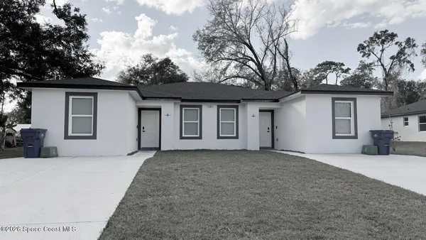 a house with trees in the background