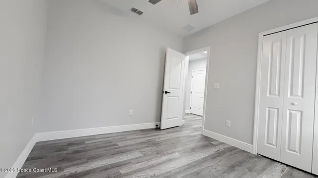 an empty room with wooden floor