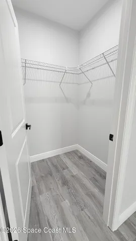 a view of a room with racks on the wall