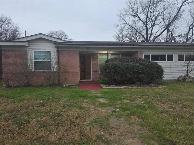 front view of a house with a garden