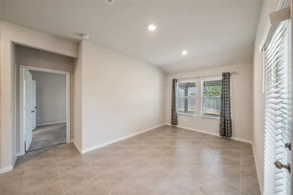 a view of an empty room with a window