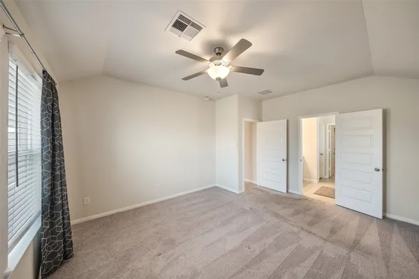 a view of an empty room with a window
