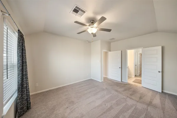 a view of an empty room with a window