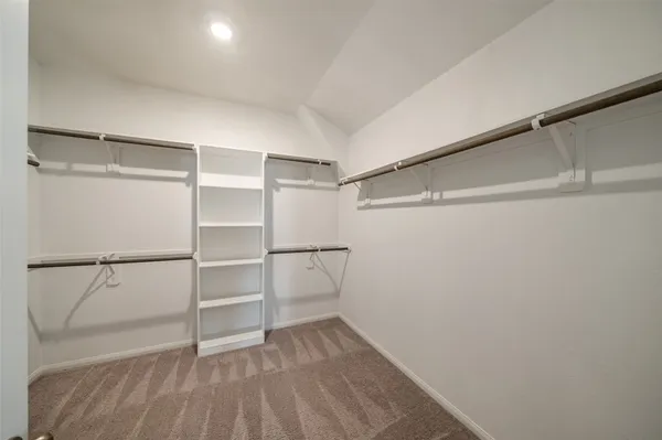 a view of an empty walk in closet