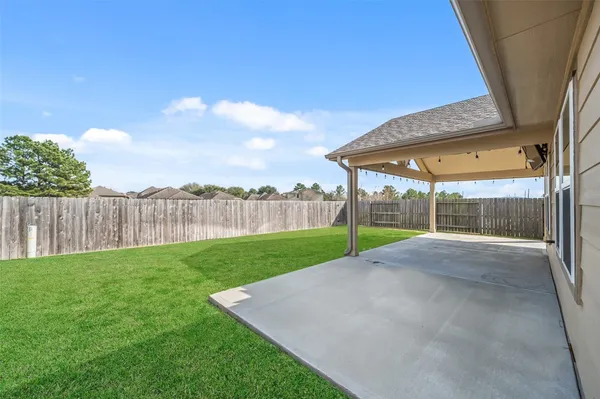 a view of a backyard with green space
