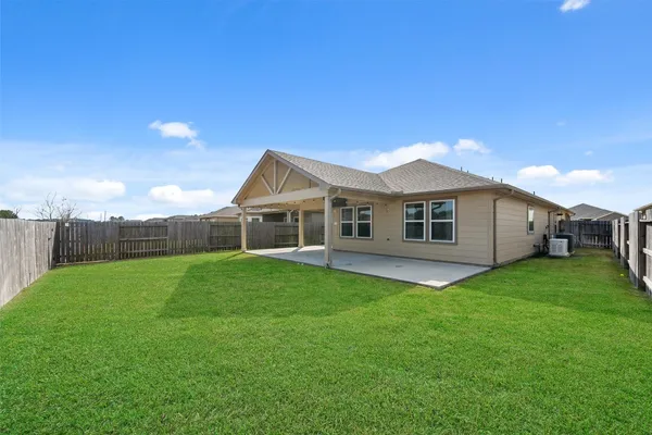 a view of a backyard of the house