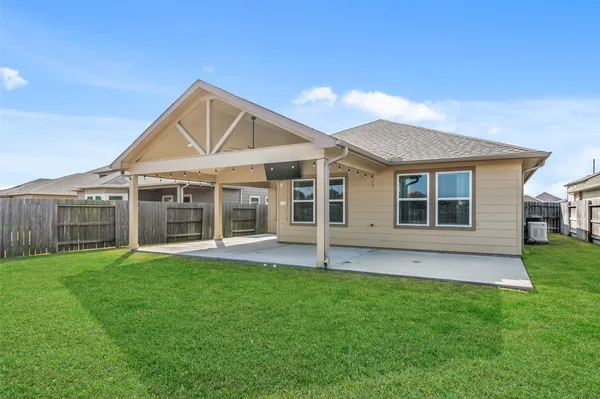 a front view of a house with a yard and porch