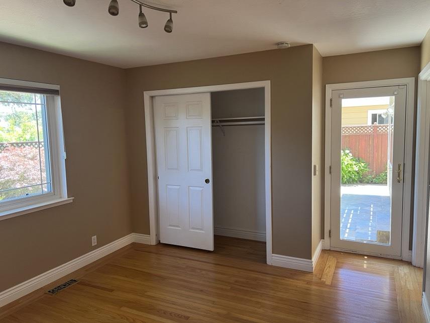 5 Maple Way San Carlos, CA 94070 - Photo 17 of 21 an empty room with wooden floor and windows