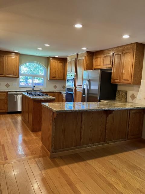 5 Maple Way San Carlos, CA 94070 - Photo 5 of 21 a kitchen with large cabinets a sink and wooden floor