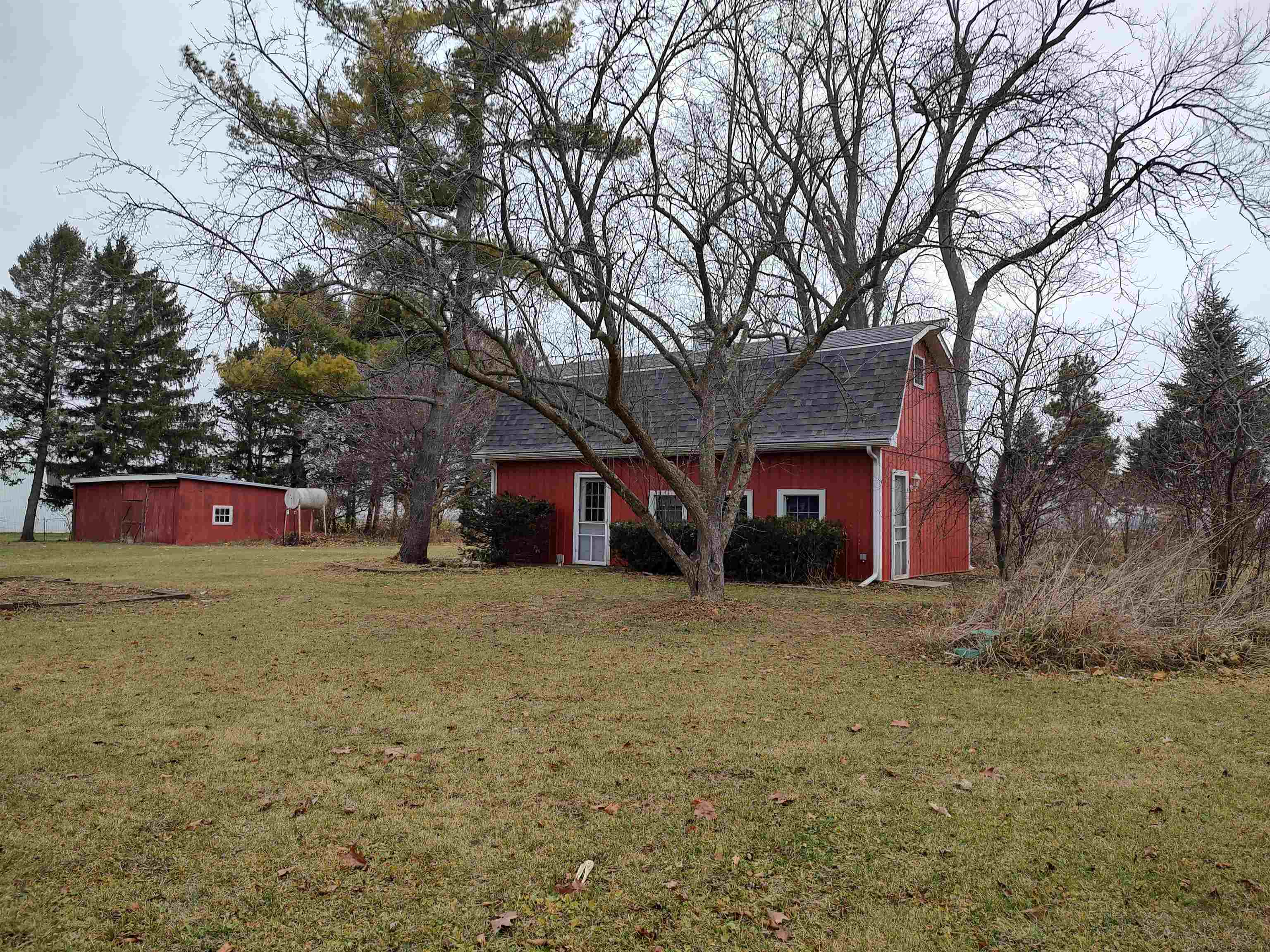 11090 Woodstock Road Garden Prairie, IL 61038 - Photo 17 of 37 a house with trees in front of it