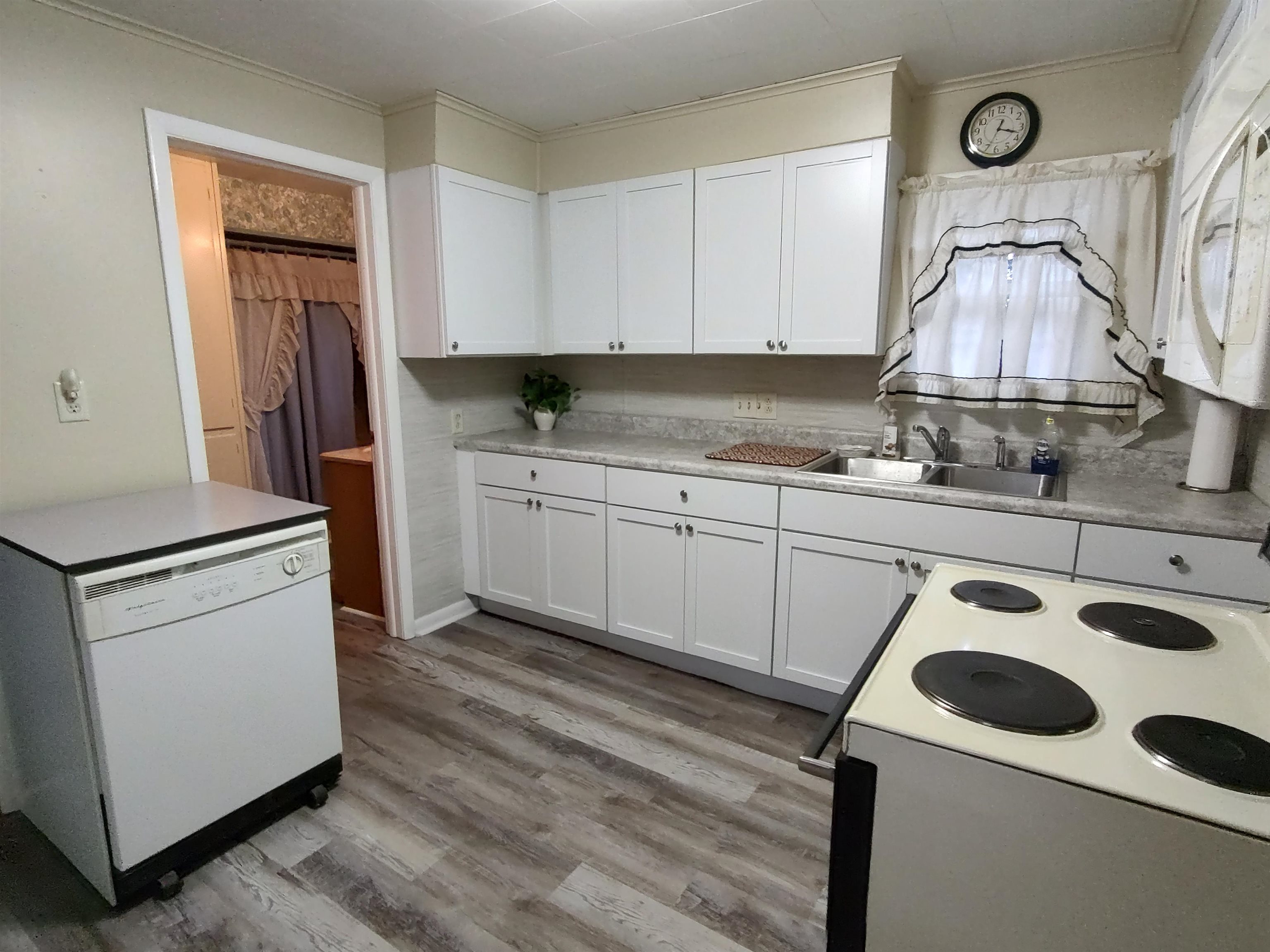 11090 Woodstock Road Garden Prairie, IL 61038 - Photo 25 of 37 a kitchen with a sink a stove and cabinets