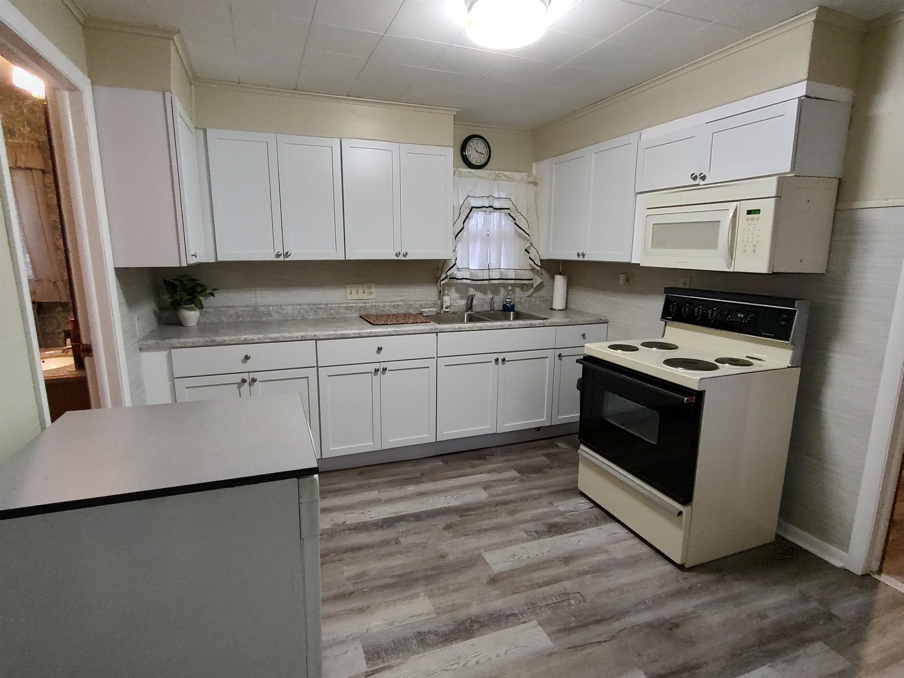 11090 Woodstock Road Garden Prairie, IL 61038 - Photo 26 of 37 a kitchen with stainless steel appliances granite countertop a stove a sink and a refrigerator