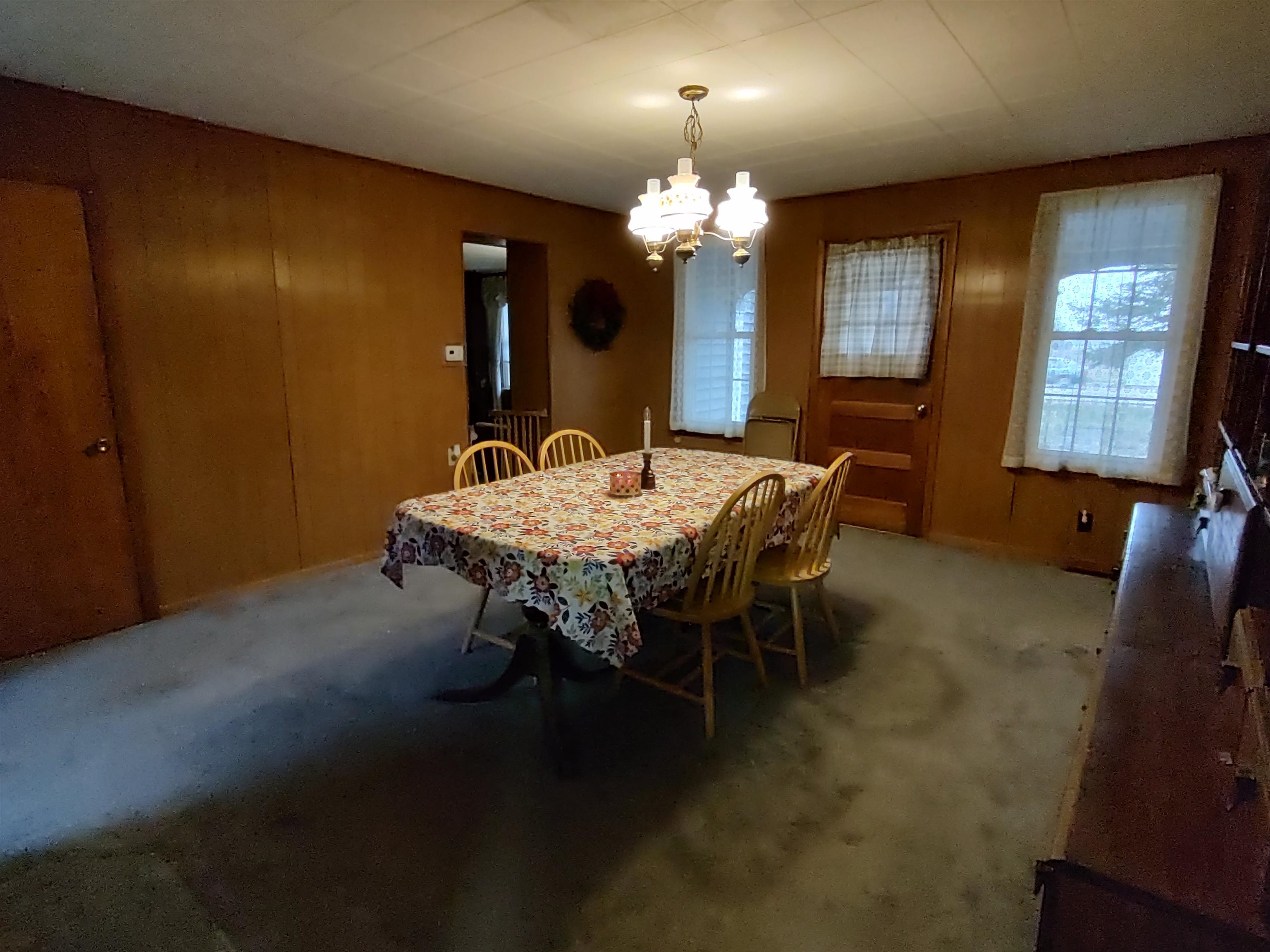 11090 Woodstock Road Garden Prairie, IL 61038 - Photo 29 of 37 a dining room with furniture and chandelier