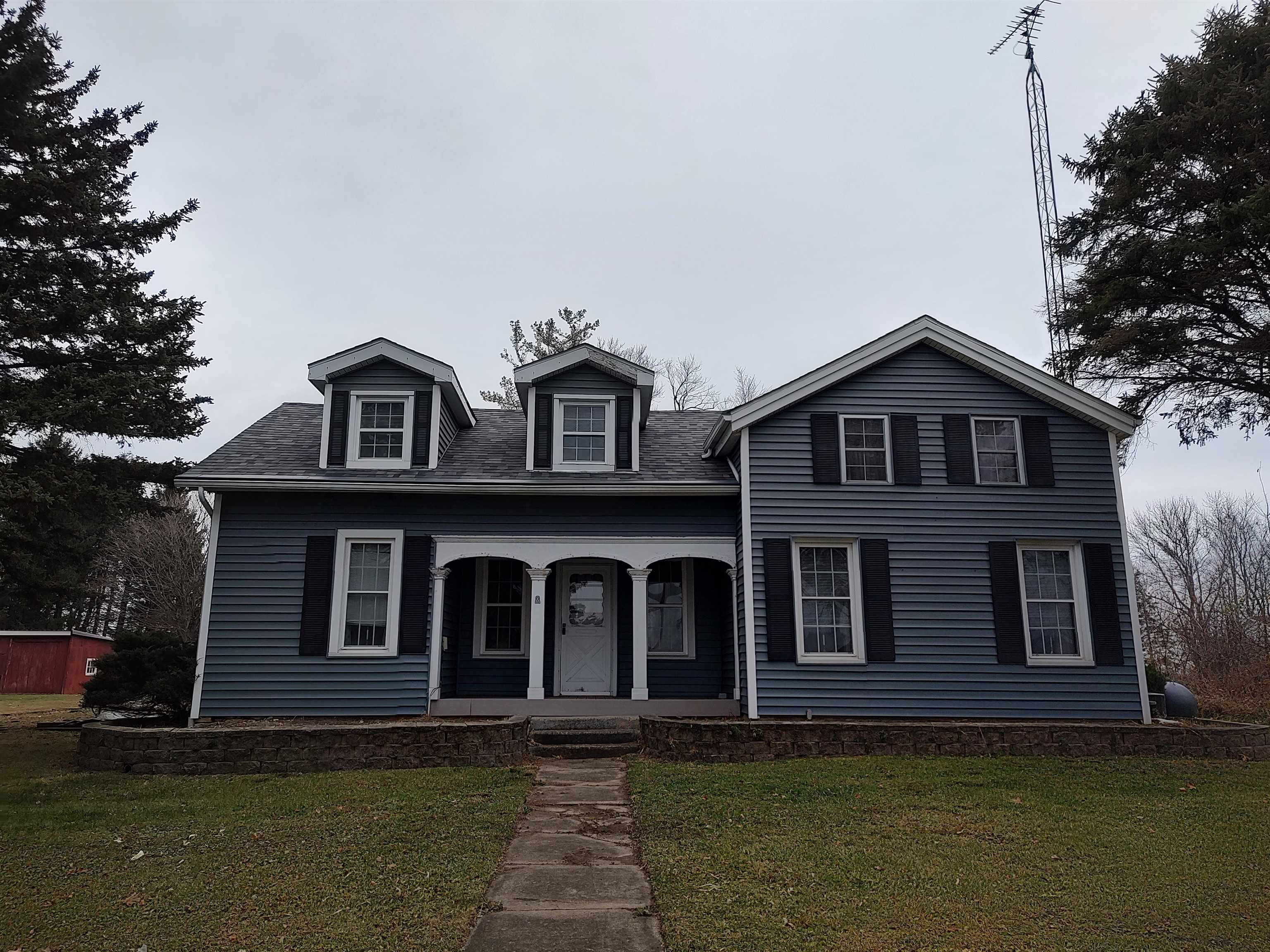11090 Woodstock Road Garden Prairie, IL 61038 - Photo 4 of 37 a front view of a house with garden