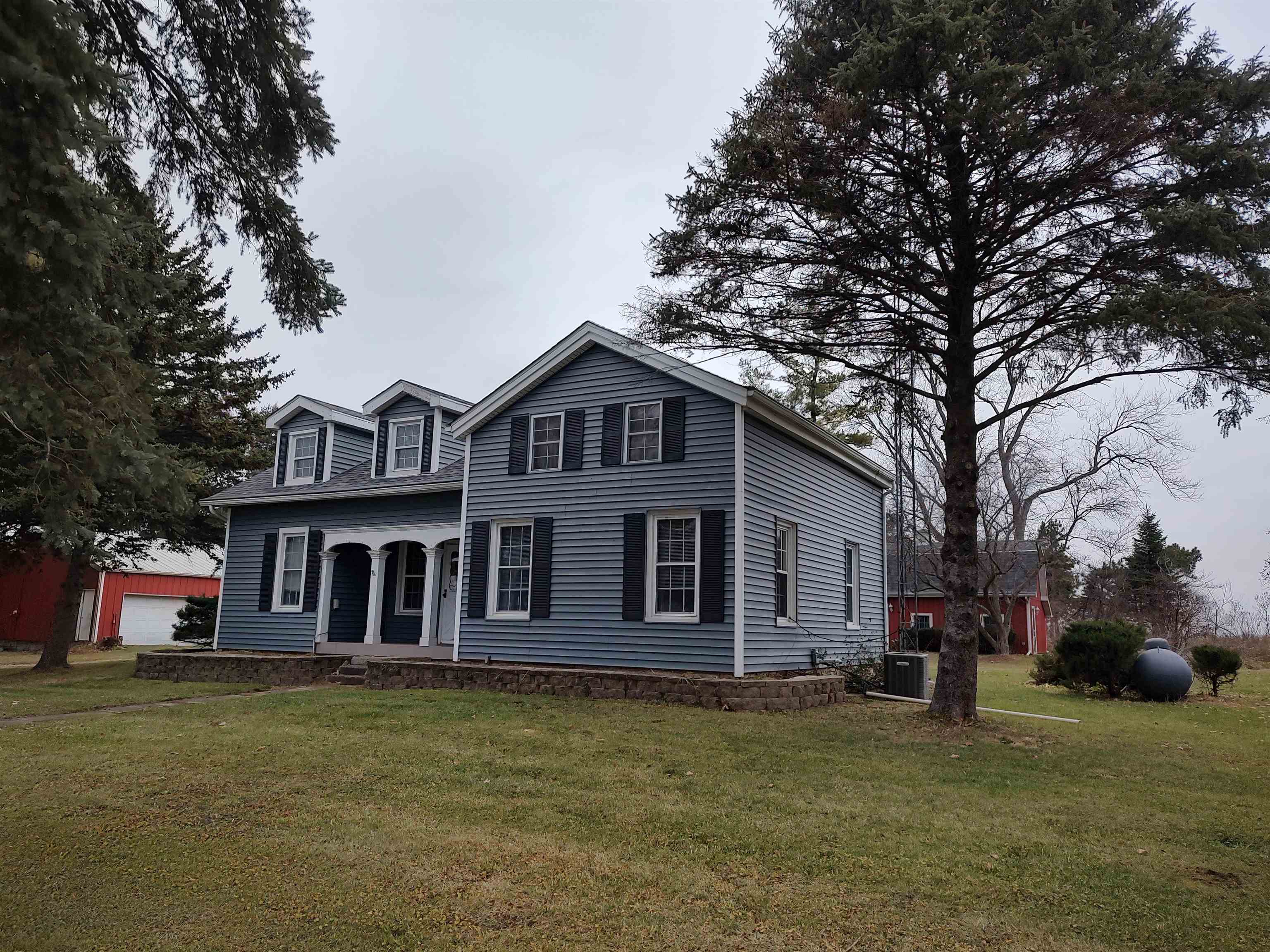 11090 Woodstock Road Garden Prairie, IL 61038 - Photo 5 of 37 a front view of a house with a garden