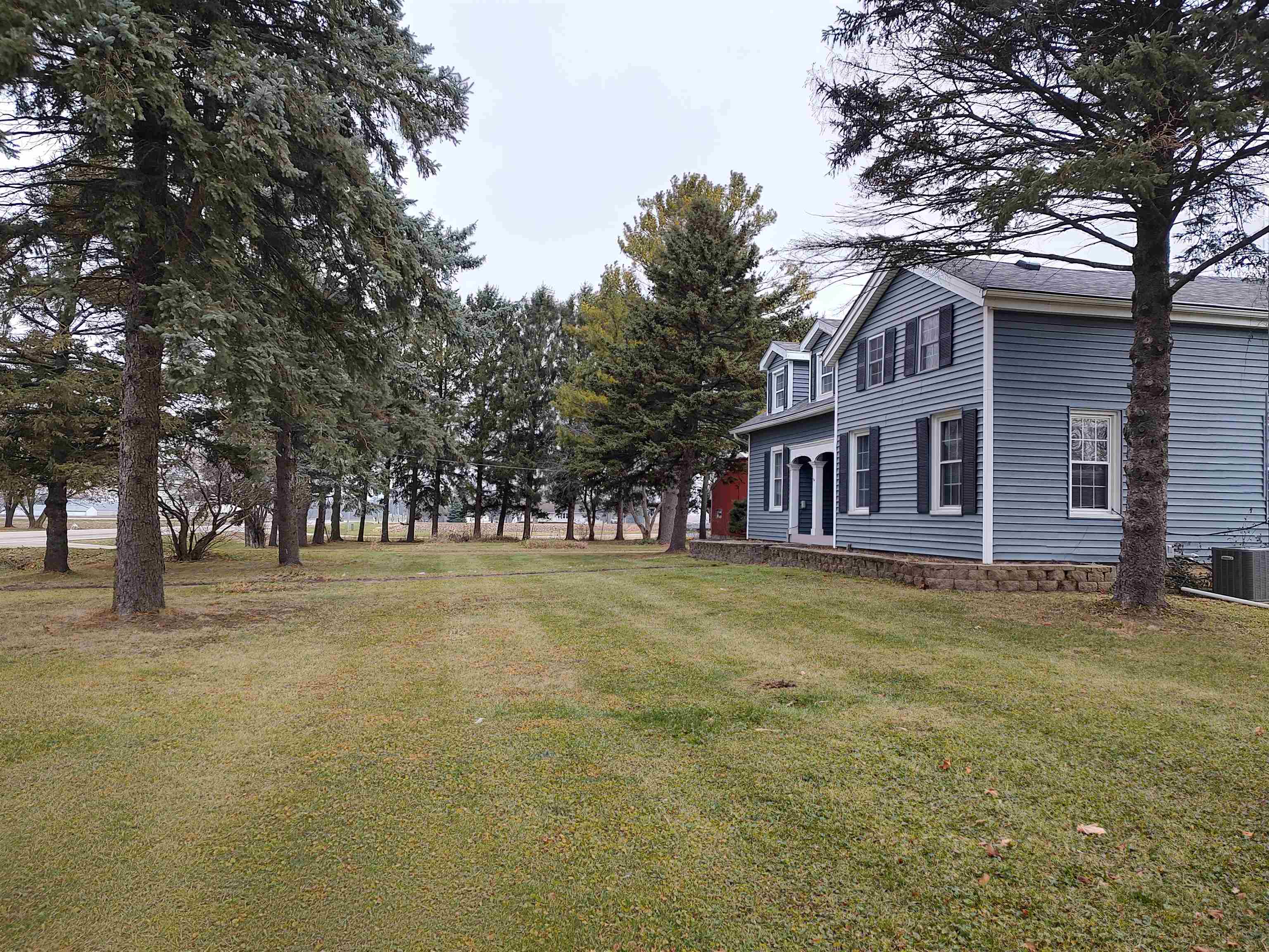 11090 Woodstock Road Garden Prairie, IL 61038 - Photo 6 of 37 a front view of a house with a garden