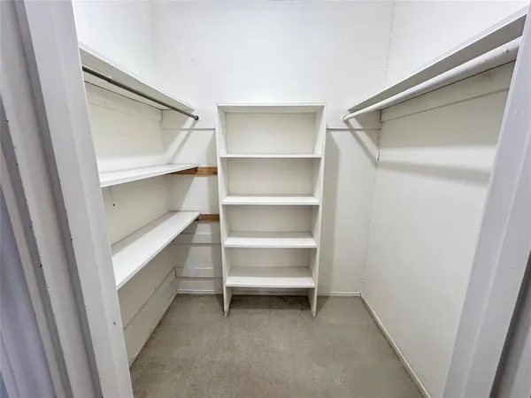 a view of an empty walk in closet