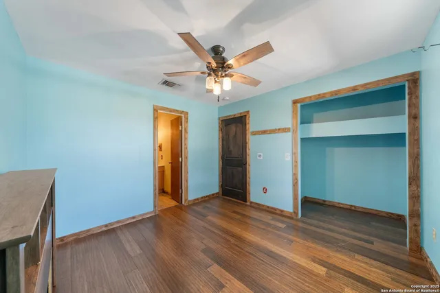a view of a livingroom with a chandelier fan