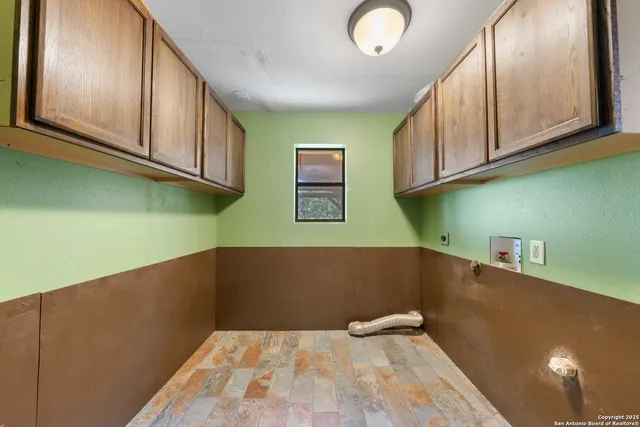 a view of a kitchen with dishwasher and cabinets