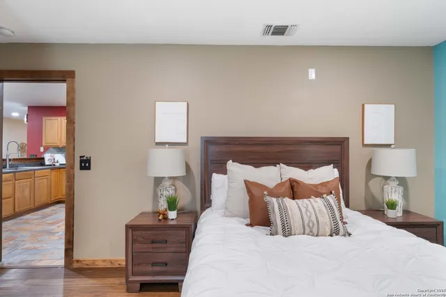 a bed room with a bed and a lamp