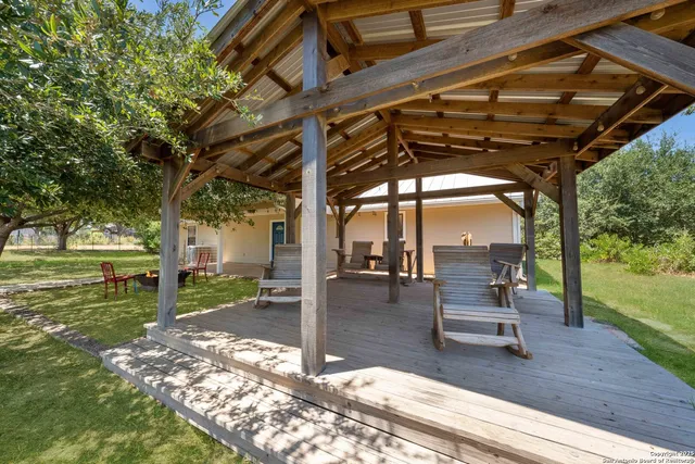 a view of yard with patio