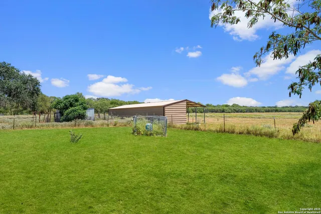 a view of a big yard next to a yard