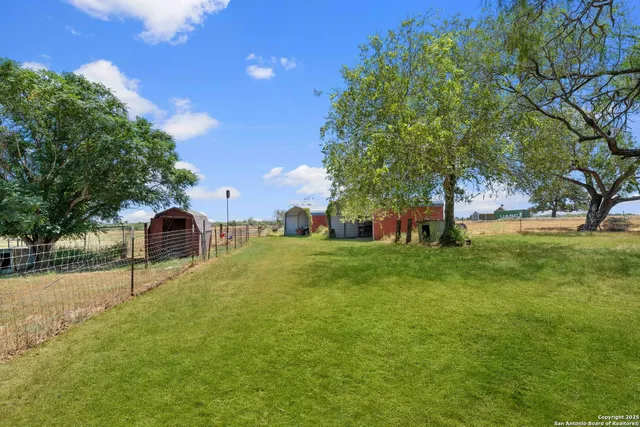 a view of a playground with basketball court