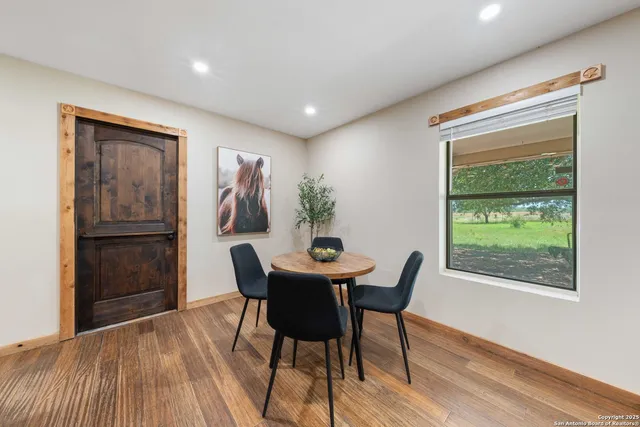 a dining room with furniture and window
