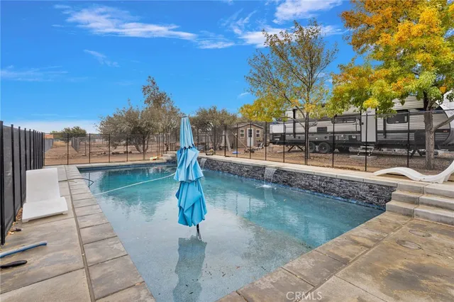 a view of a swimming pool with a patio