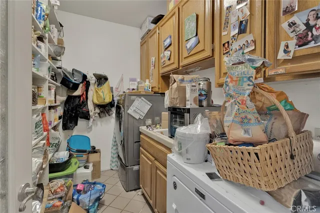 a bedroom with a bed and dresser with mirror