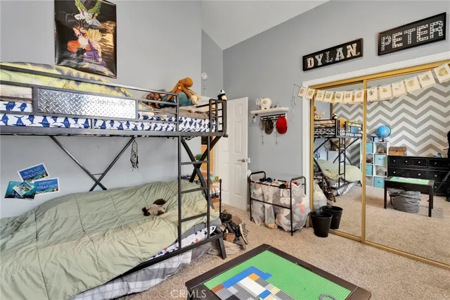 a bathroom with a granite countertop sink a toilet a mirror and shower