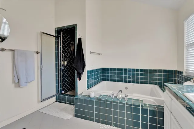 a view of a patio with table and chairs and potted plants