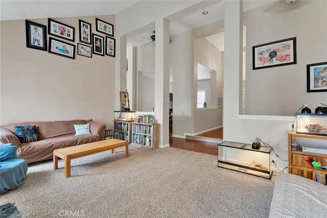 a view of a patio with table and chairs under an umbrella
