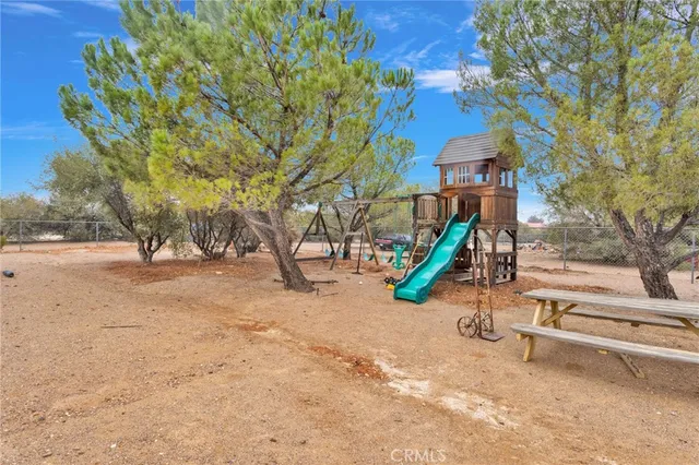 an aerial view of house with yard swimming pool and outdoor seating