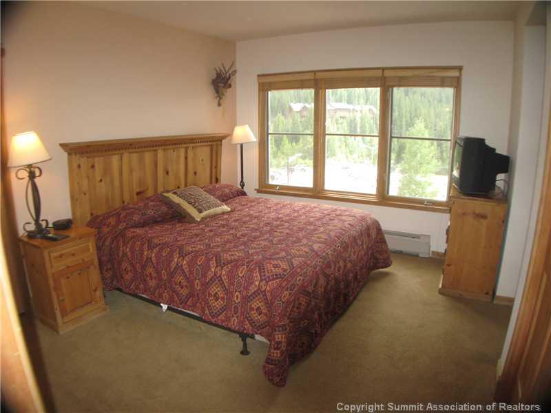 195 River Run Road, Unit 8053 Keystone, CO 80435 - Photo 9 of 16 a bed sitting in a bedroom next to a window