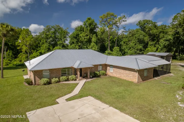 a house with trees in the background