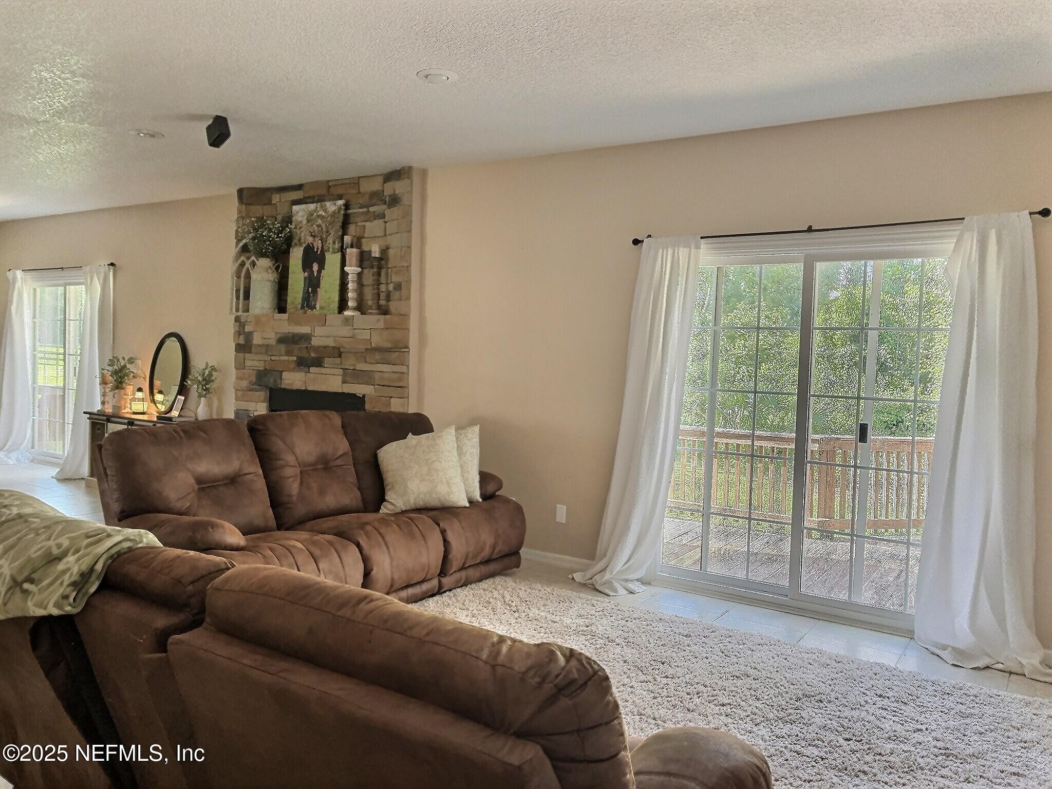 224 Crocus Lane Hawthorne, FL 32640 - Photo 19 of 58 a living room with furniture and a window