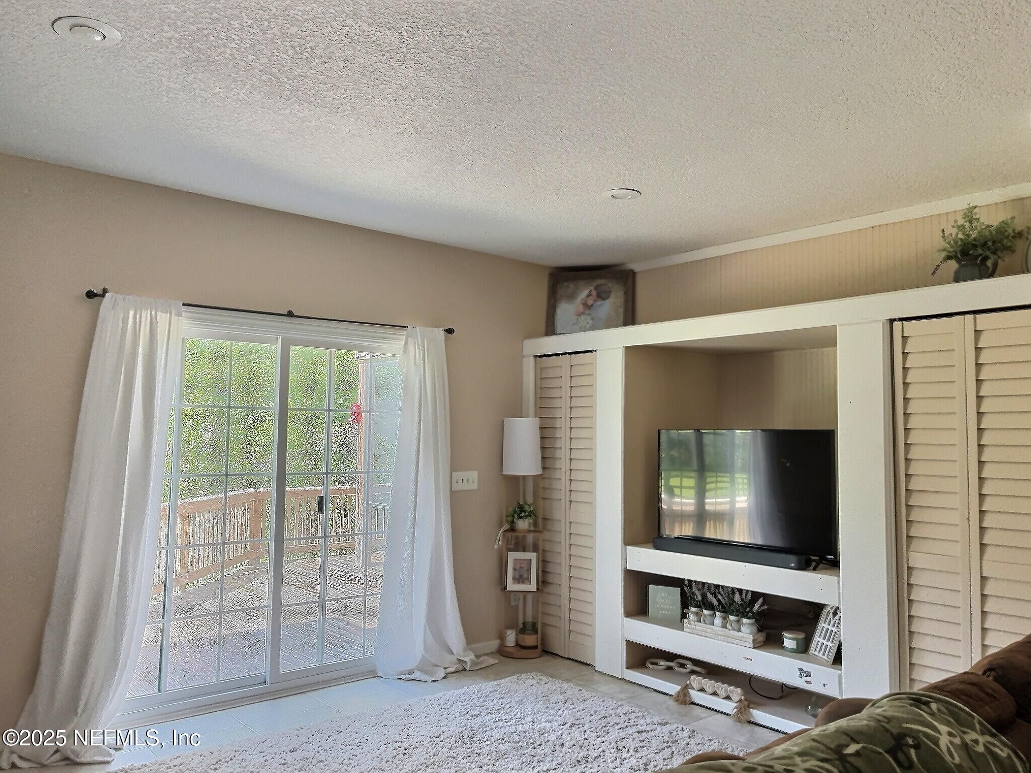 224 Crocus Lane Hawthorne, FL 32640 - Photo 21 of 58 a living room with furniture and a flat screen tv