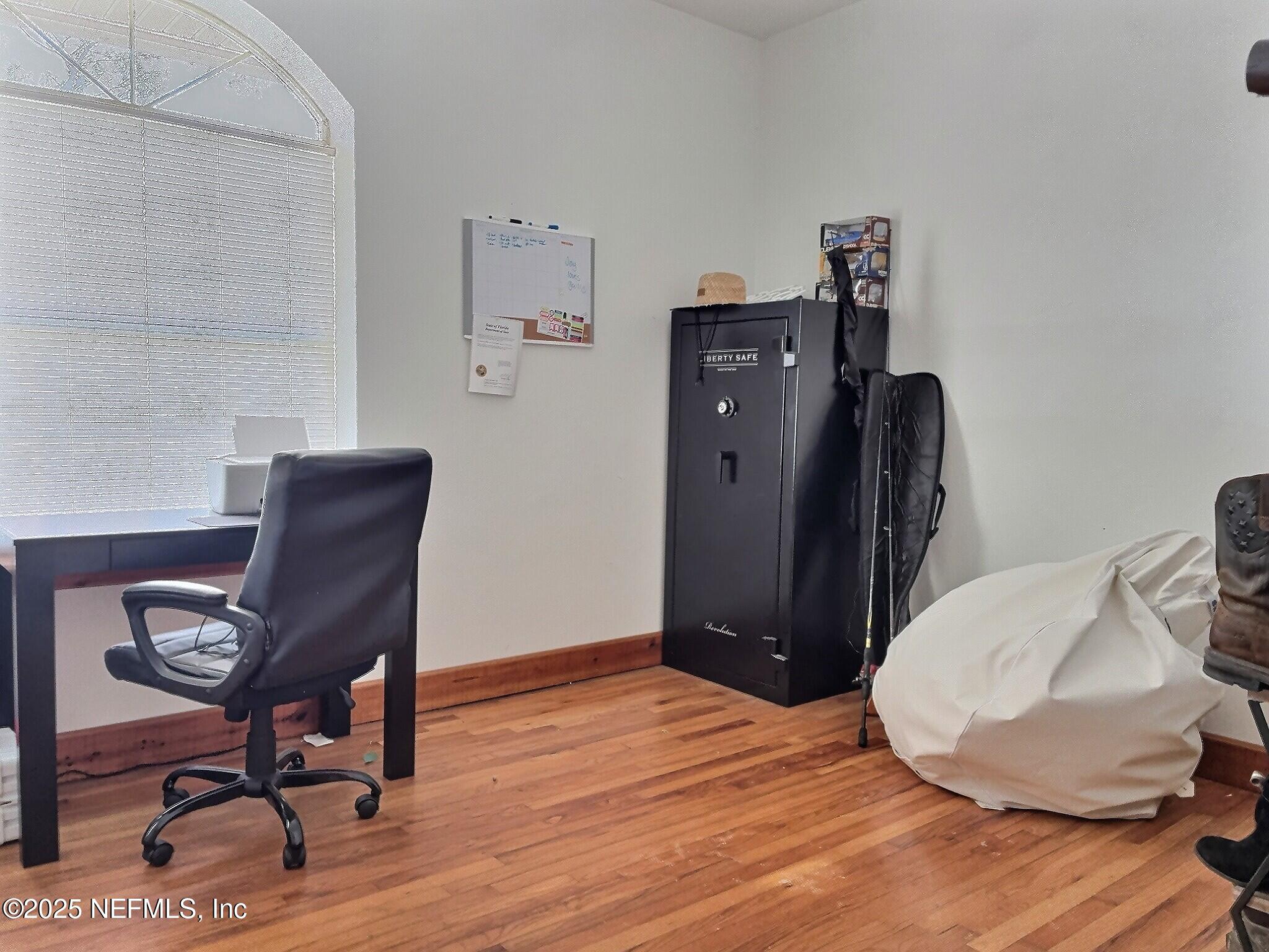 224 Crocus Lane Hawthorne, FL 32640 - Photo 39 of 58 a view of a workspace with furniture and wooden floor
