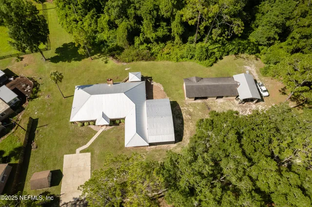 a kitchen with granite countertop sink table and chairs
