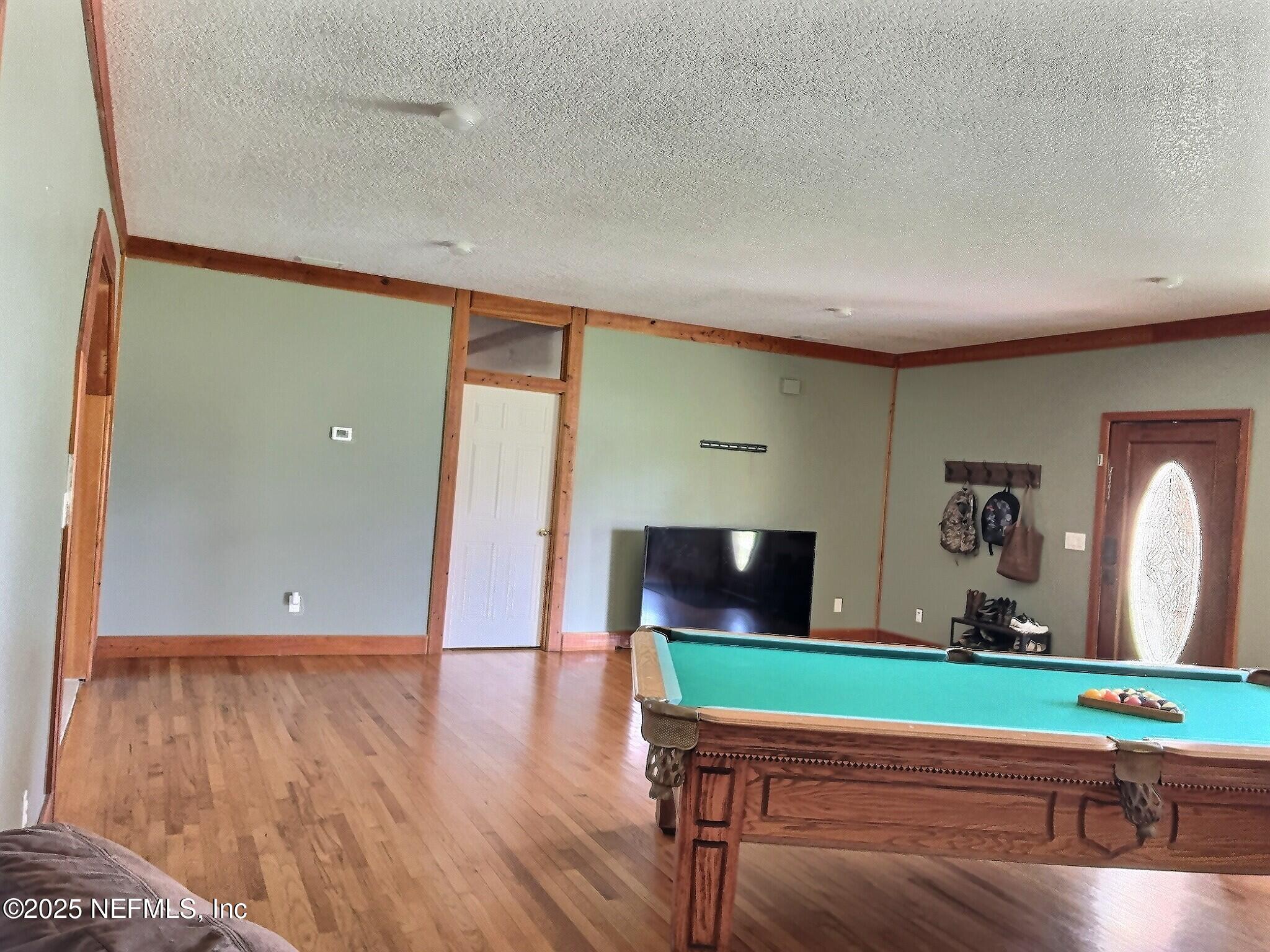 224 Crocus Lane Hawthorne, FL 32640 - Photo 41 of 58 a room with lots of wooden floor and furniture