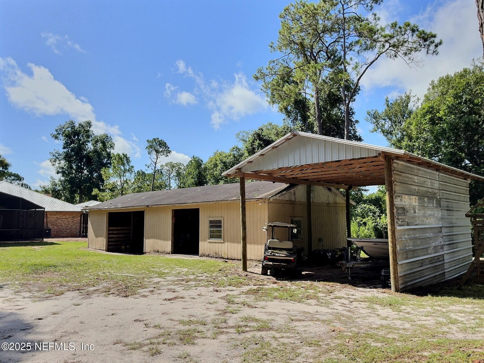 224 Crocus Lane Hawthorne, FL 32640 - Photo 50 of 58 a view of a house with a yard