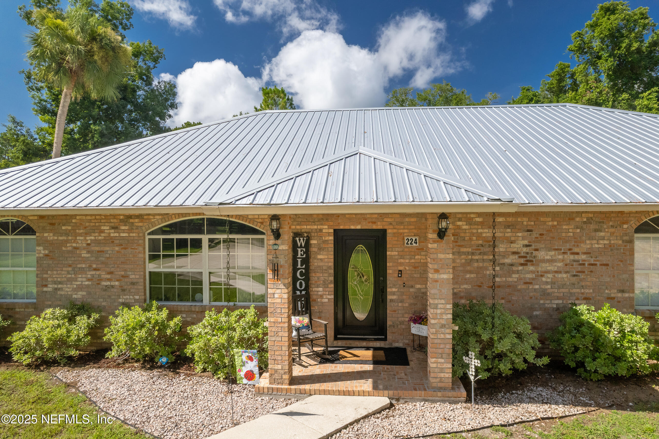 224 Crocus Lane Hawthorne, FL 32640 - Photo 5 of 58 a front view of a house with garden