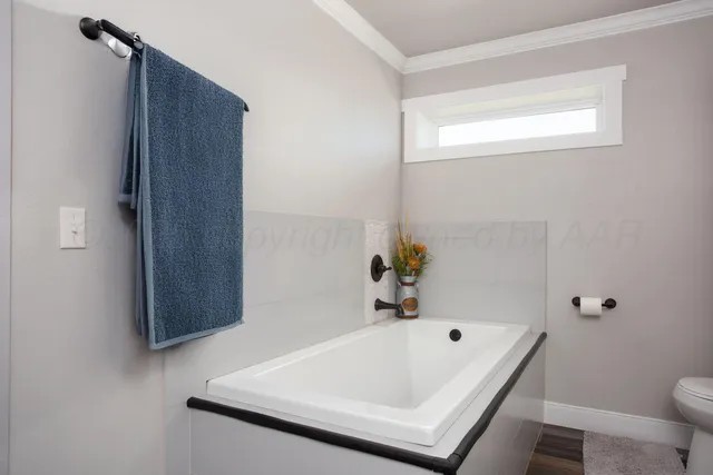 a bathroom with a tub and shower