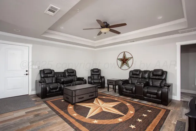 a living room with furniture a rug and a window