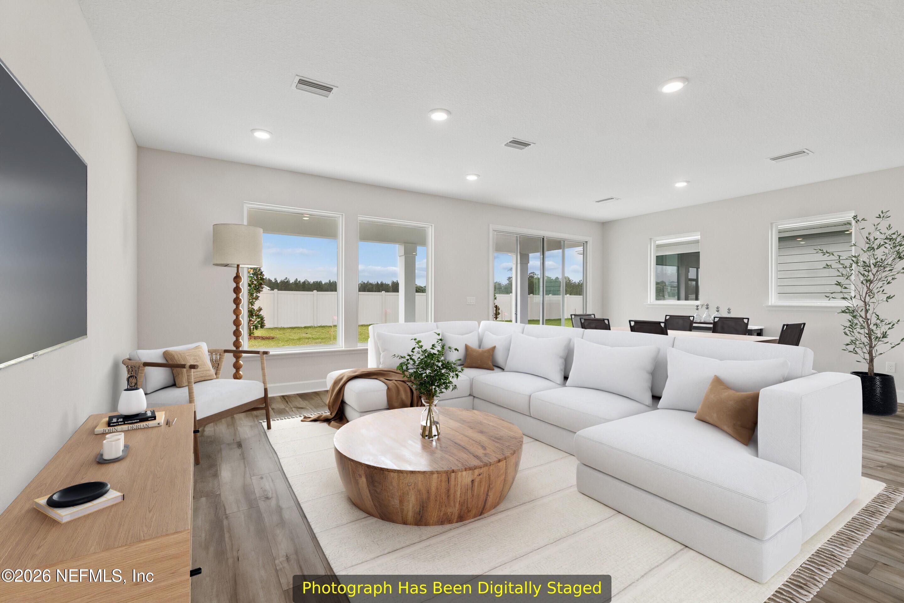 75751 Bayley Place Yulee, FL 32097 - Photo 12 of 28 a living room with furniture and a large window